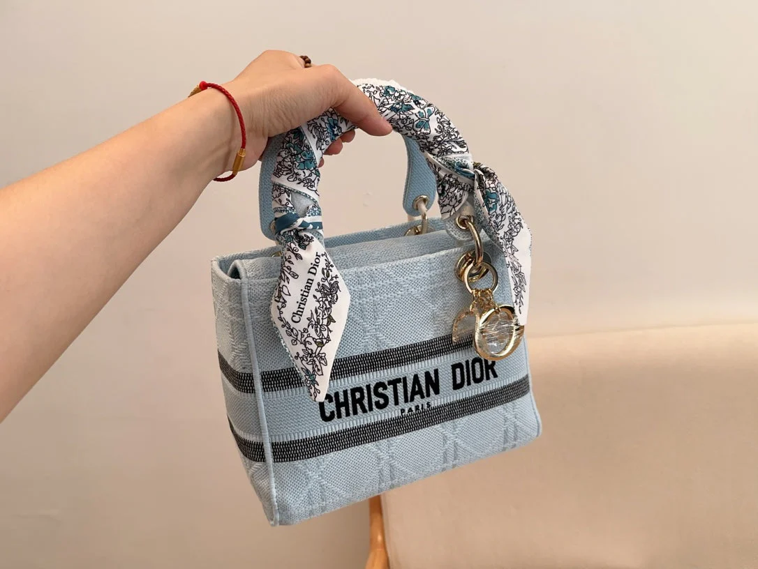 The latest sky blue rattan Diana bag with wide shoulder straps