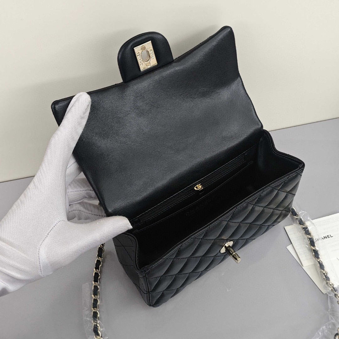 CHANEL Classic Flap CF Mini Handbag with Glossy Gold - Tone Hardware. Made of lambskin leather, it's a flap - over bag that can be carried as a handbag, shoulder bag or crossbody bag. Mini size, for women, black.