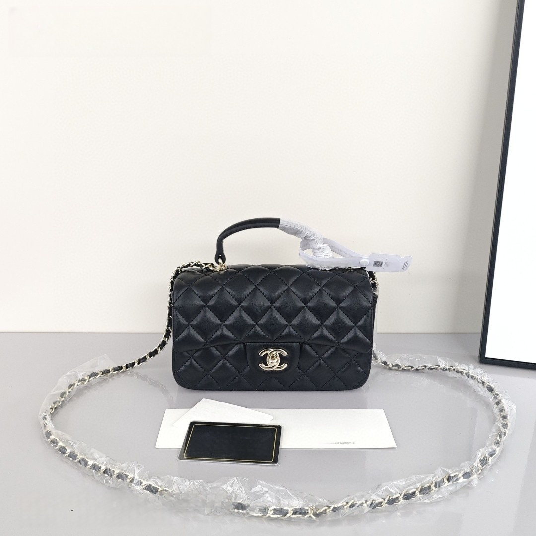 CHANEL Classic Flap CF Mini Handbag with Glossy Gold - Tone Hardware. Made of lambskin leather, it's a flap - over bag that can be carried as a handbag, shoulder bag or crossbody bag. Mini size, for women, black.