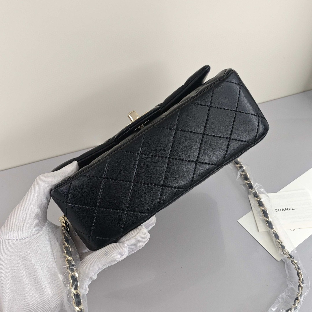 CHANEL Classic Flap CF Mini Handbag with Glossy Gold - Tone Hardware. Made of lambskin leather, it's a flap - over bag that can be carried as a handbag, shoulder bag or crossbody bag. Mini size, for women, black.