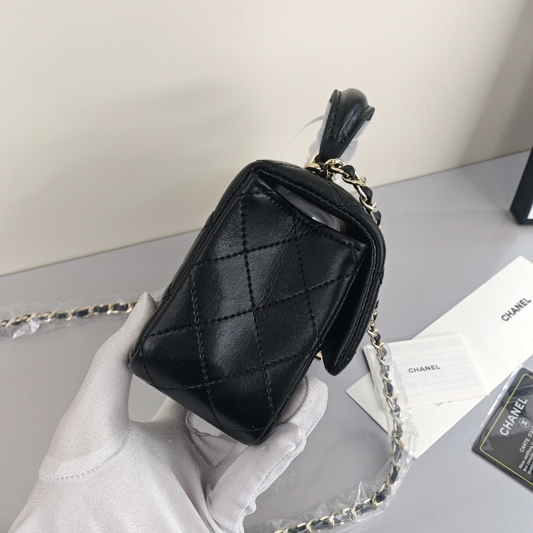 CHANEL Classic Flap CF Mini Handbag with Glossy Gold - Tone Hardware. Made of lambskin leather, it's a flap - over bag that can be carried as a handbag, shoulder bag or crossbody bag. Mini size, for women, black.