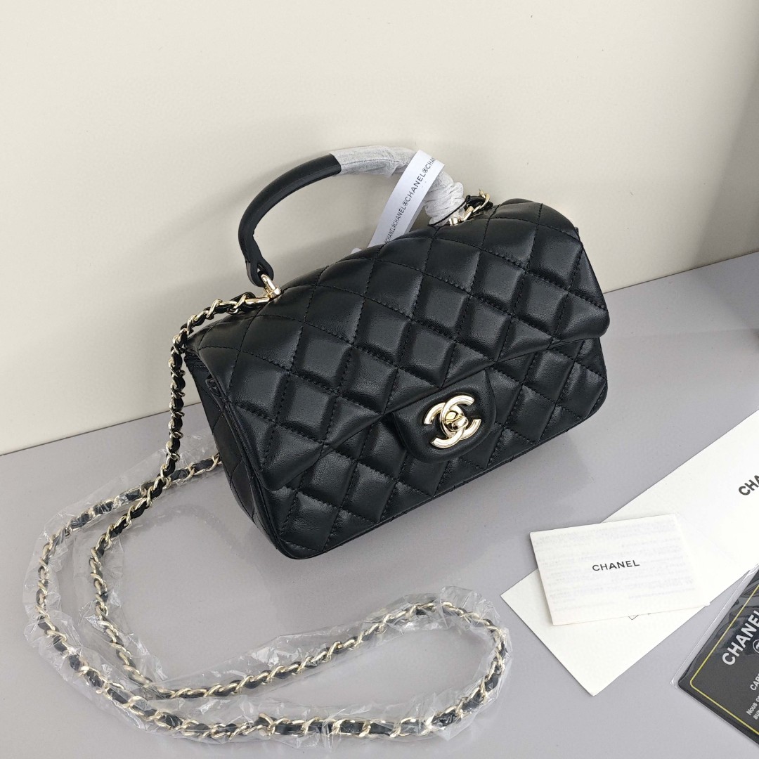 CHANEL Classic Flap CF Mini Handbag with Glossy Gold - Tone Hardware. Made of lambskin leather, it's a flap - over bag that can be carried as a handbag, shoulder bag or crossbody bag. Mini size, for women, black.