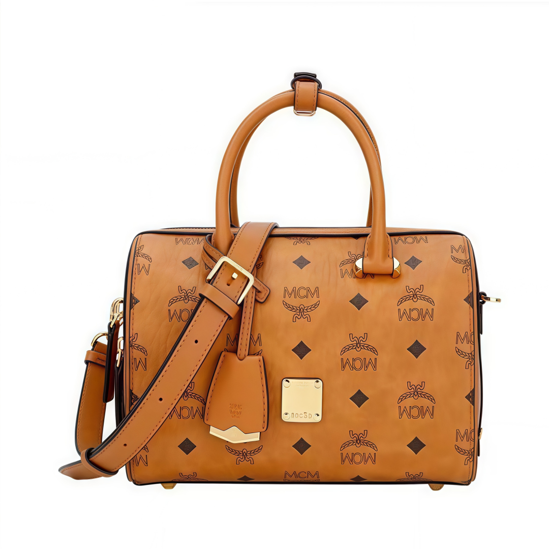 MCM Aren Original Visetos Boston Bag with Leather Trim. Can be carried by hand, worn crossbody or on the shoulder. Unisex Style. Brown.