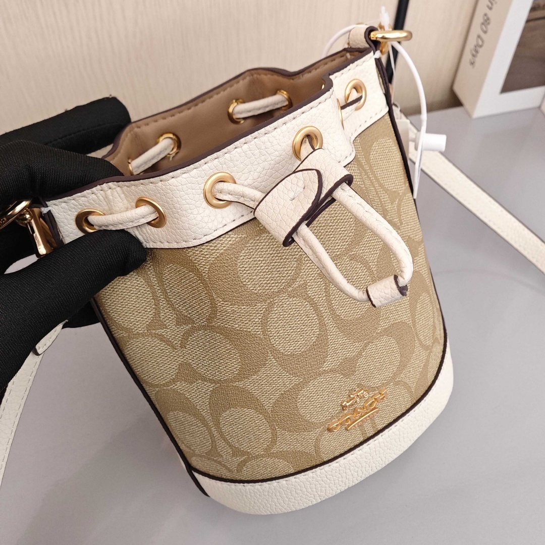 COACH Dempsey 15 Classic Monogram Canvas Coating with Cowhide Trim Bucket Bag, Handbag & Crossbody Bag, Mini Size, Women's Style, Light Khaki