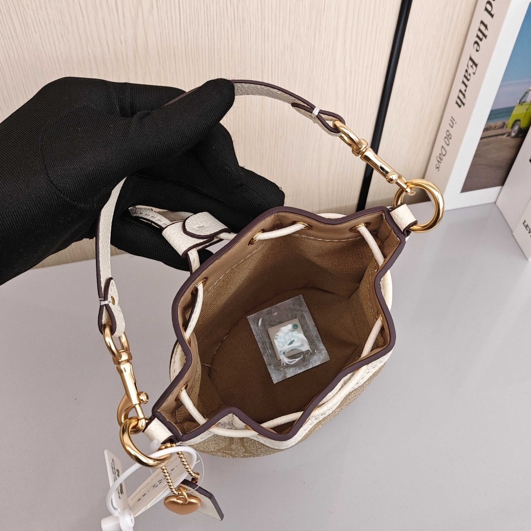 COACH Dempsey 15 Classic Monogram Canvas Coating with Cowhide Trim Bucket Bag, Handbag & Crossbody Bag, Mini Size, Women's Style, Light Khaki