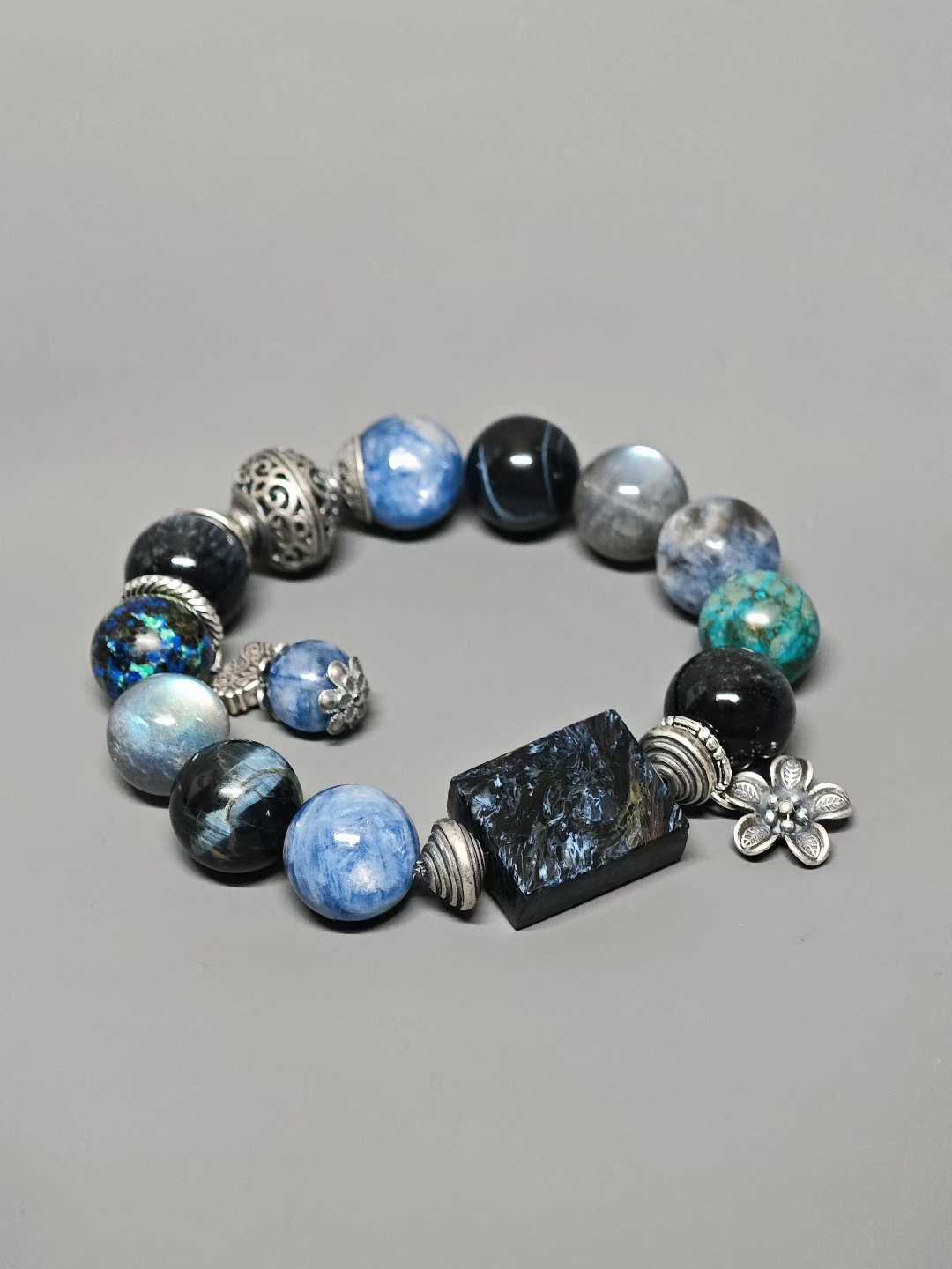 Waves kiss the sandy shore, stars sink to the sea floor.The night’s sea is moonlight shattered into salt.