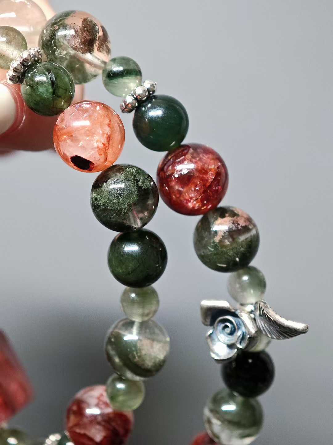 Thorns guard the fragrant cluster,Crimson glows intense beneath the sun.Beauty hides between the spines—Silent, it stands proud against the east wind.