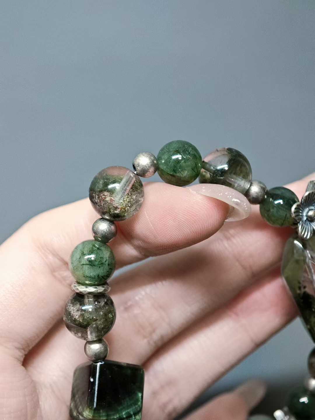 Singing, I walk toward the water,Ten thousand green mountains merge with the sky.