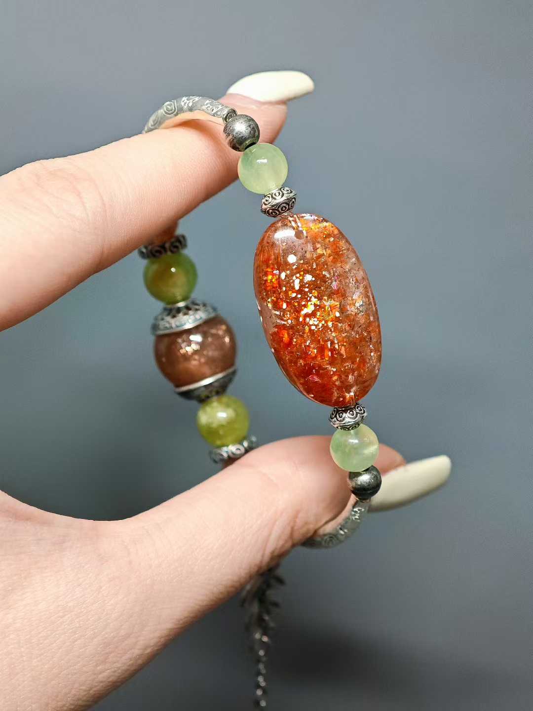 The rising sun breaks through cloud-wreathed peaks,Golden rays dye the green fields.A thousand mountains hold the dawn’s glow,A bird’s wing pierces the sky’s last dimness.