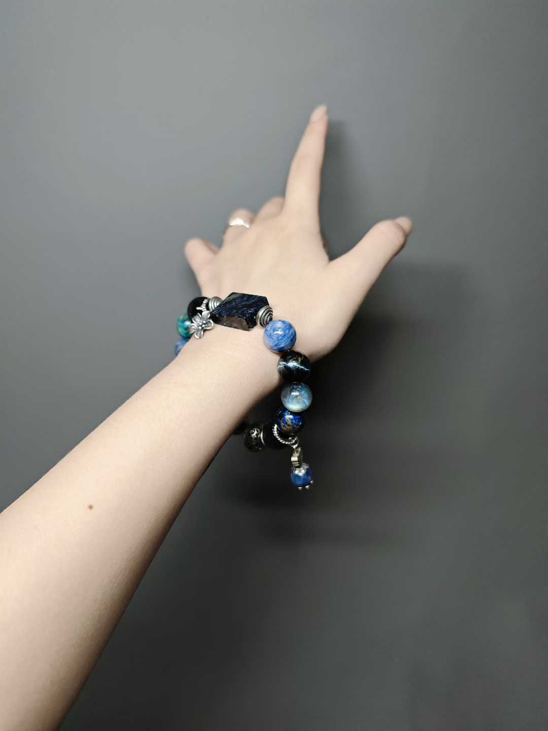 Waves kiss the sandy shore, stars sink to the sea floor.The night’s sea is moonlight shattered into salt.