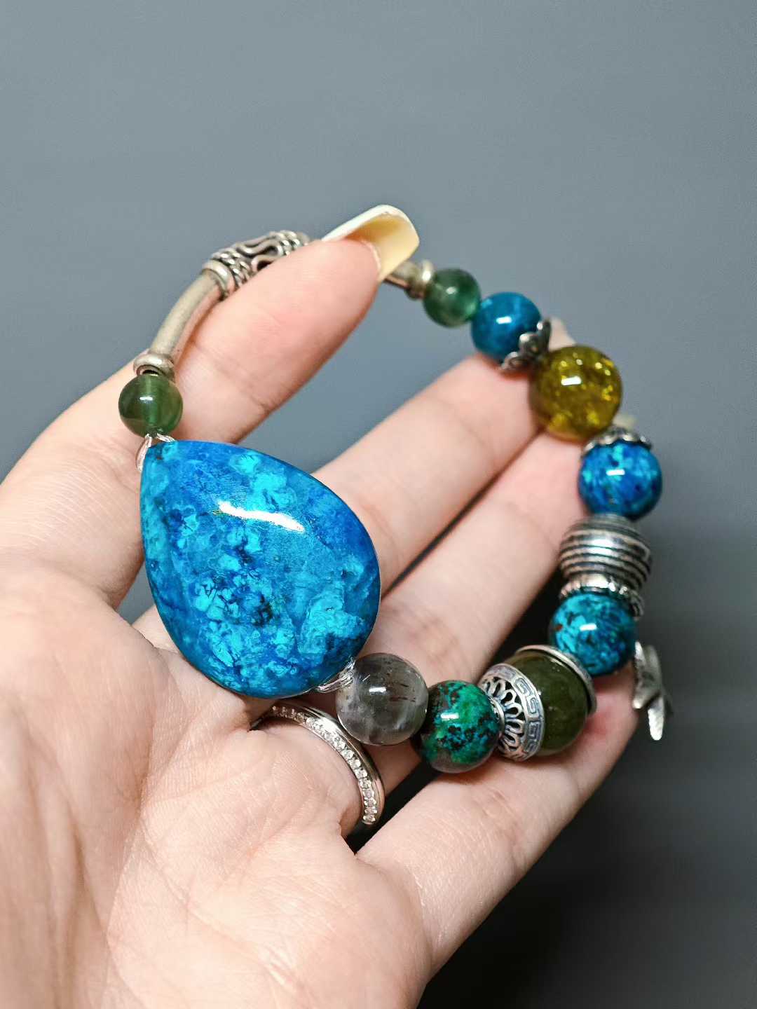 A handful of azure waves I hold, A thousand tastes of life hidden within. What I gather are but bubbles— Cast them aside, and there’s the azure again.
