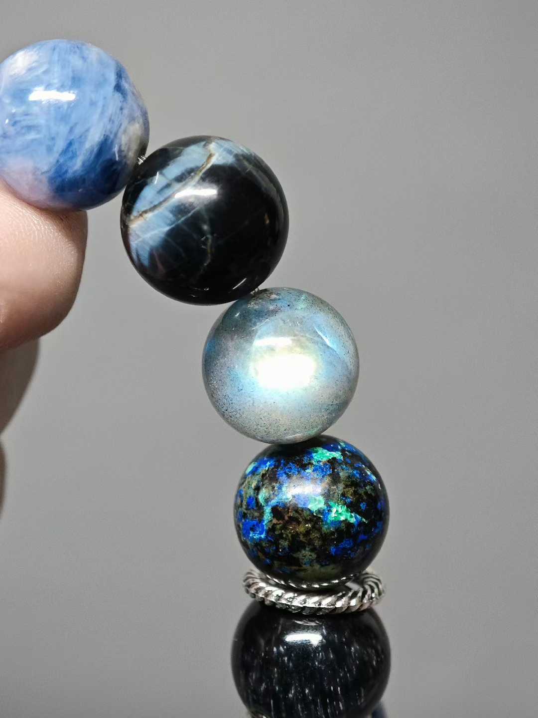 Waves kiss the sandy shore, stars sink to the sea floor.The night’s sea is moonlight shattered into salt.