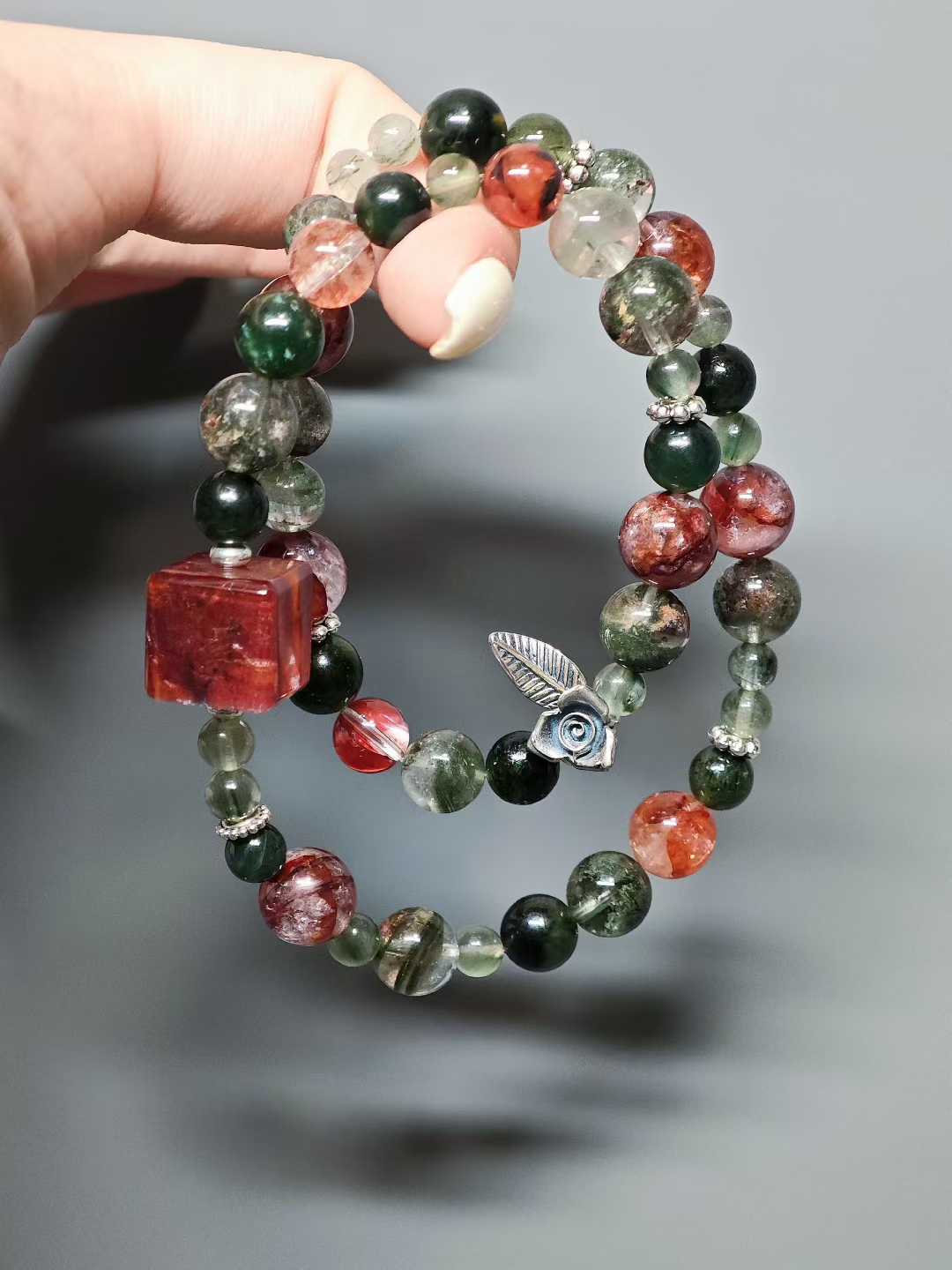 Thorns guard the fragrant cluster,Crimson glows intense beneath the sun.Beauty hides between the spines—Silent, it stands proud against the east wind.