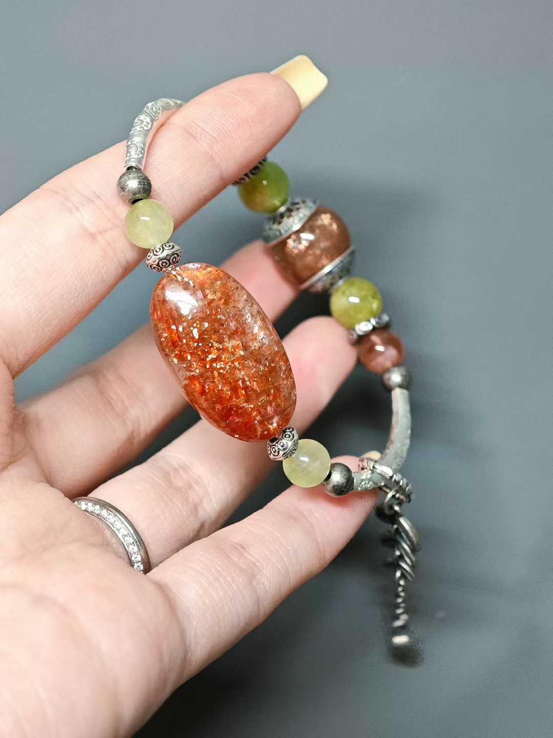 The rising sun breaks through cloud-wreathed peaks,Golden rays dye the green fields.A thousand mountains hold the dawn’s glow,A bird’s wing pierces the sky’s last dimness.