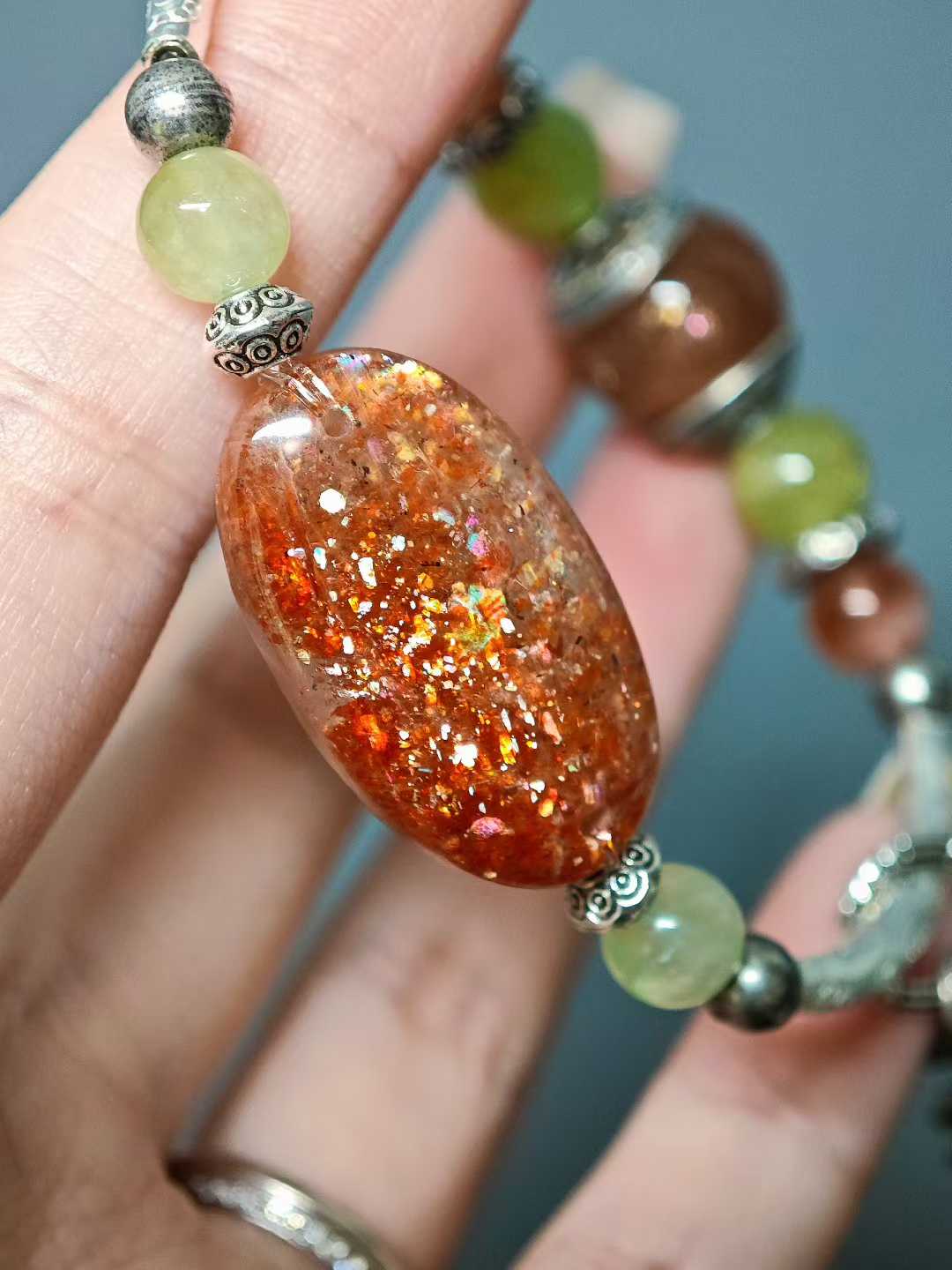 The rising sun breaks through cloud-wreathed peaks,Golden rays dye the green fields.A thousand mountains hold the dawn’s glow,A bird’s wing pierces the sky’s last dimness.