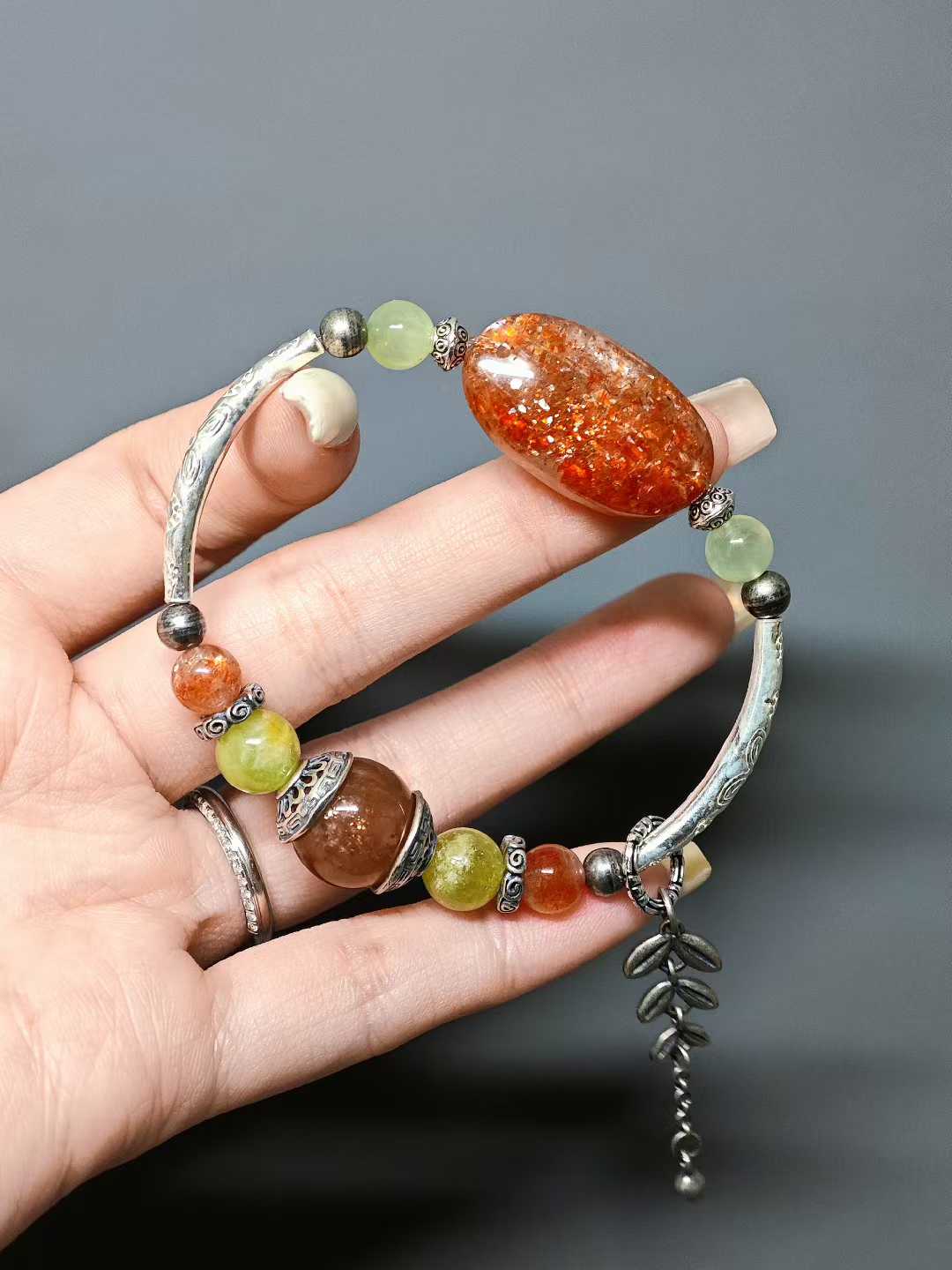 The rising sun breaks through cloud-wreathed peaks,Golden rays dye the green fields.A thousand mountains hold the dawn’s glow,A bird’s wing pierces the sky’s last dimness.