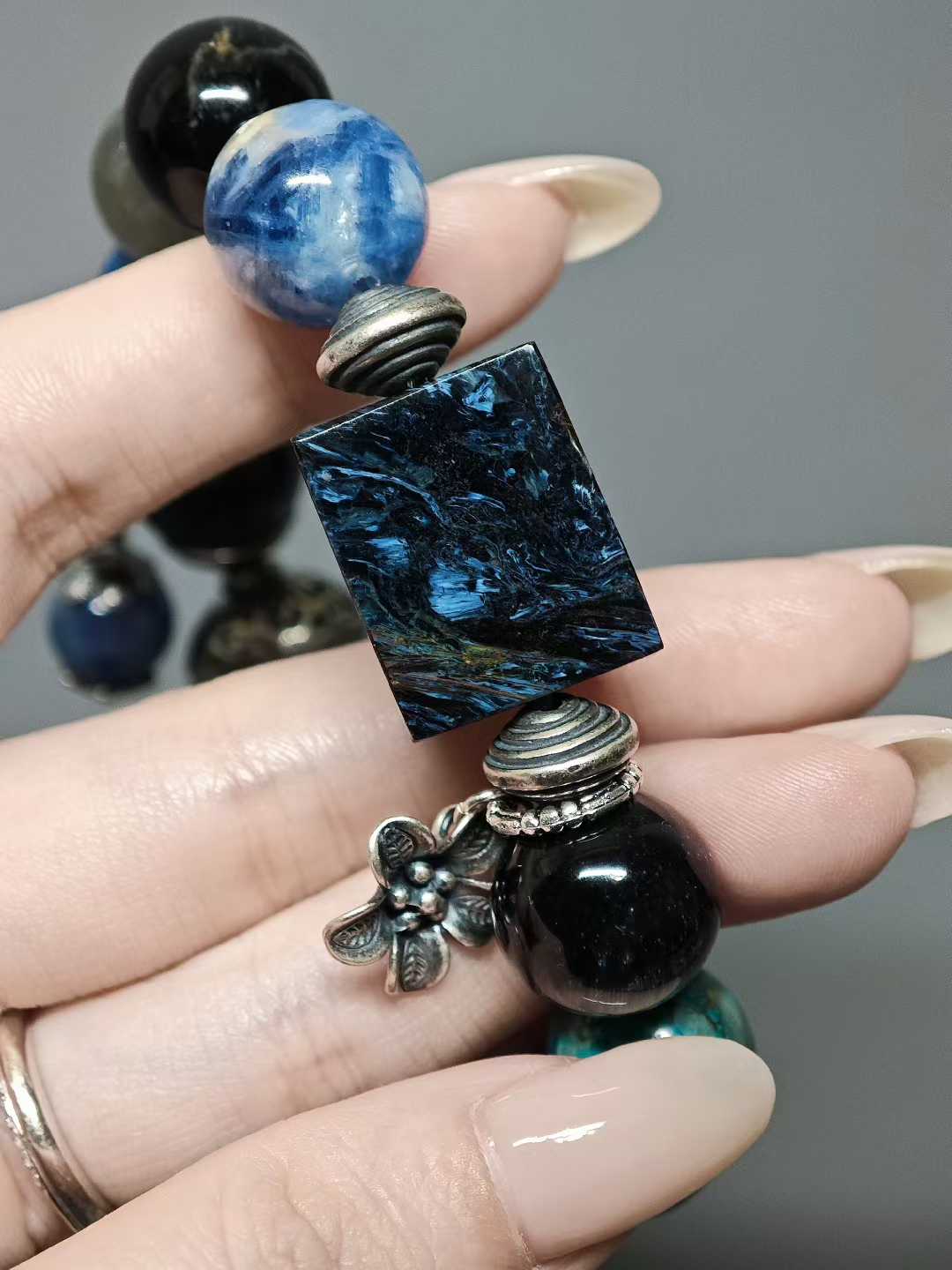 Waves kiss the sandy shore, stars sink to the sea floor.The night’s sea is moonlight shattered into salt.