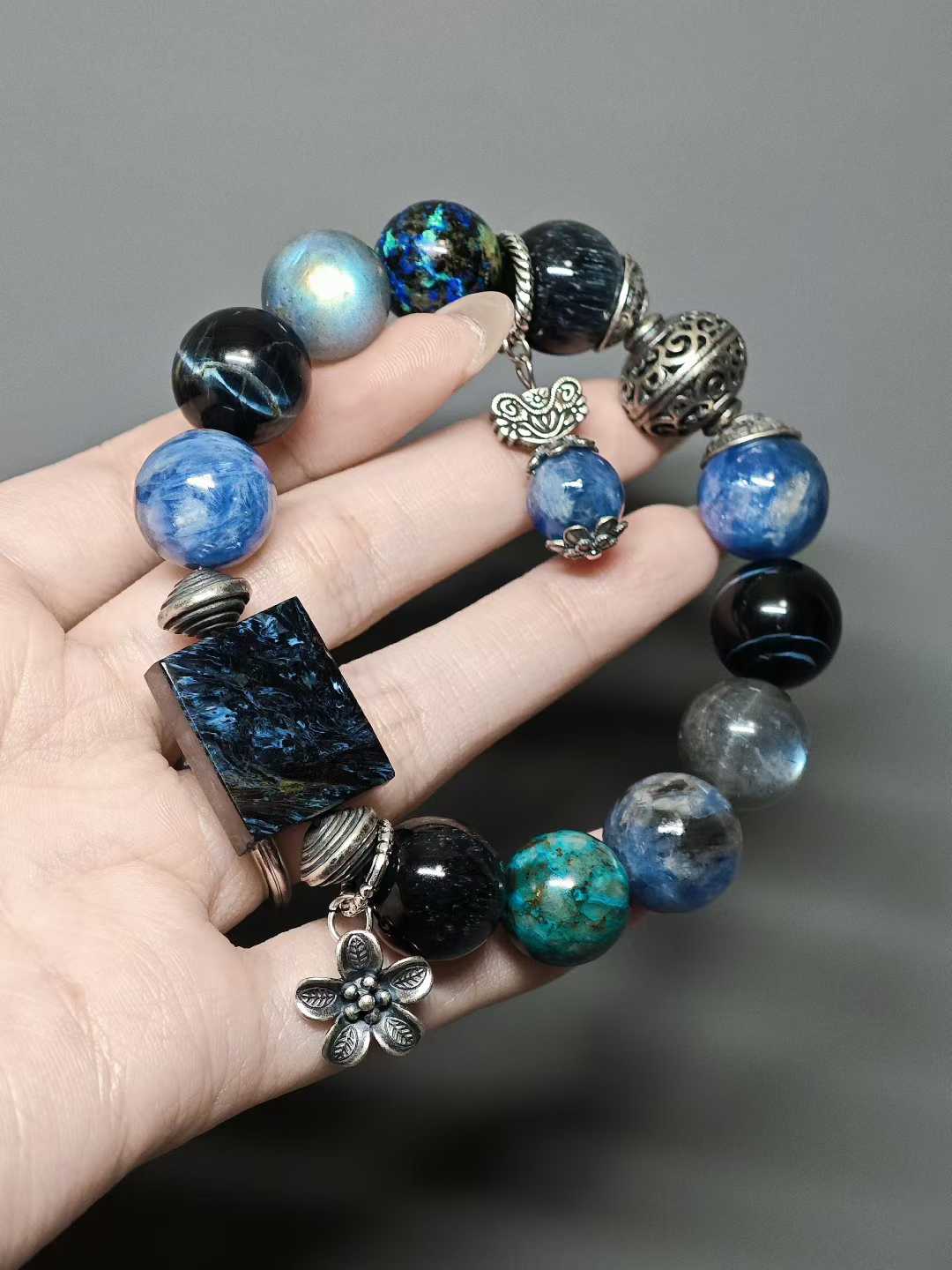 Waves kiss the sandy shore, stars sink to the sea floor.The night’s sea is moonlight shattered into salt.