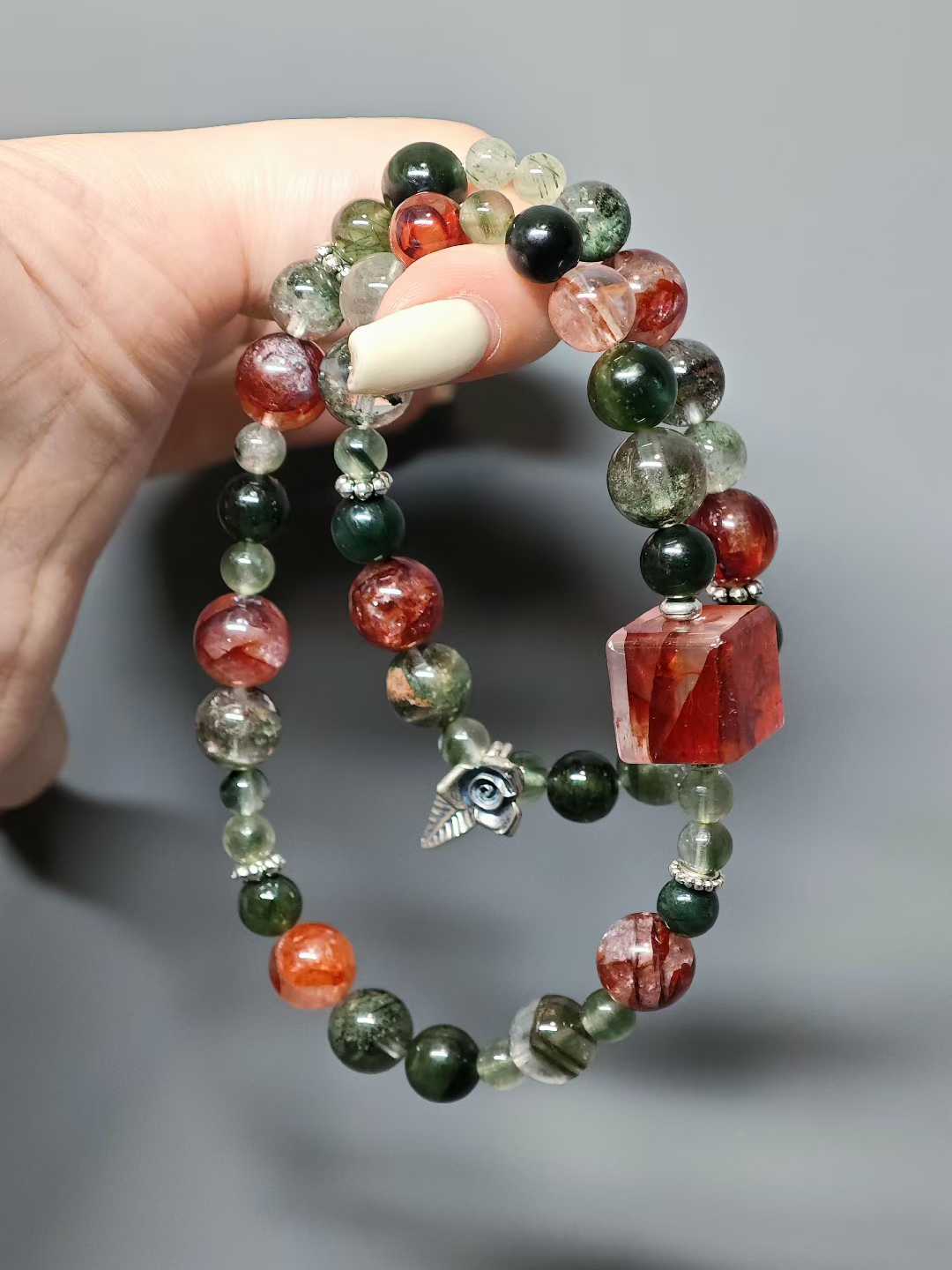 Thorns guard the fragrant cluster,Crimson glows intense beneath the sun.Beauty hides between the spines—Silent, it stands proud against the east wind.