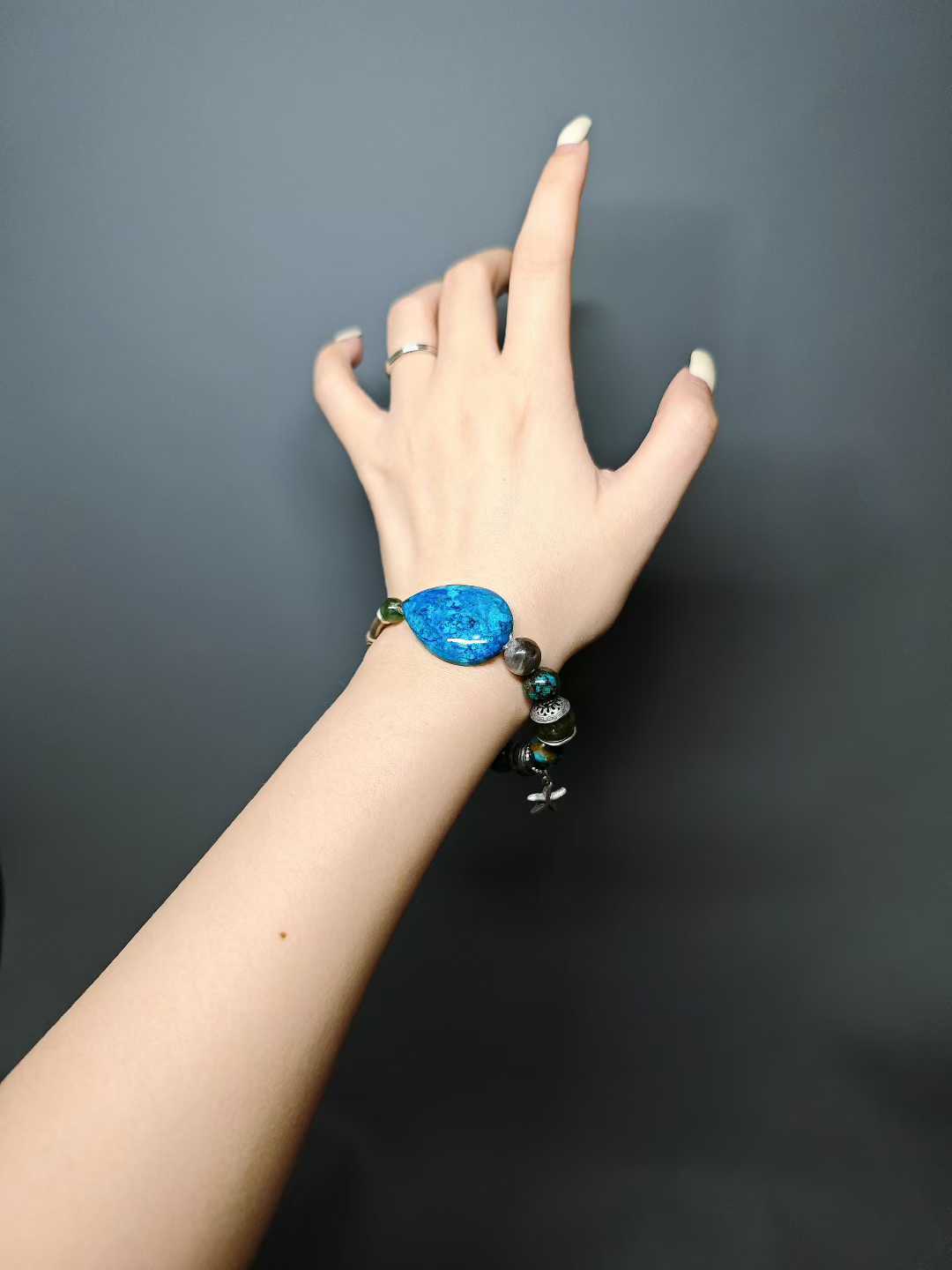 A handful of azure waves I hold, A thousand tastes of life hidden within. What I gather are but bubbles— Cast them aside, and there’s the azure again.