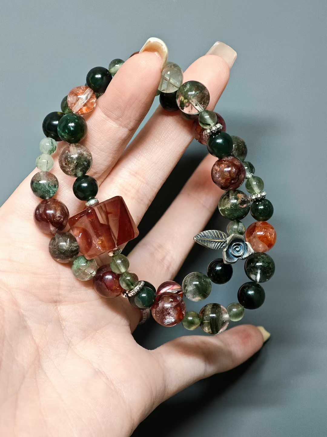 Thorns guard the fragrant cluster,Crimson glows intense beneath the sun.Beauty hides between the spines—Silent, it stands proud against the east wind.