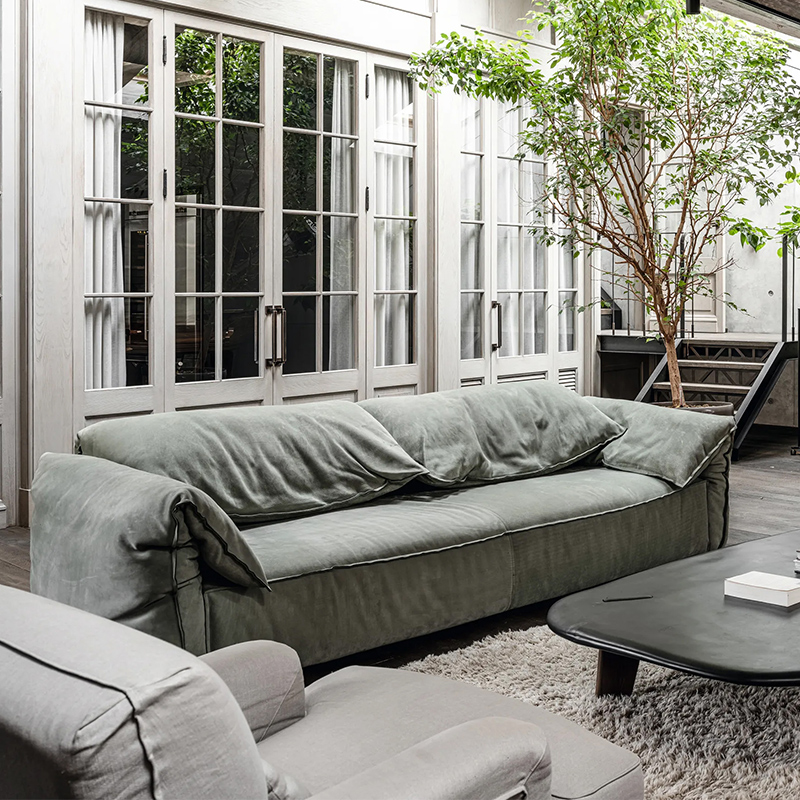 Italian minimalist elephant ear sofa, designer style light luxury frosted leather living room sofa, down filled three seater couch.