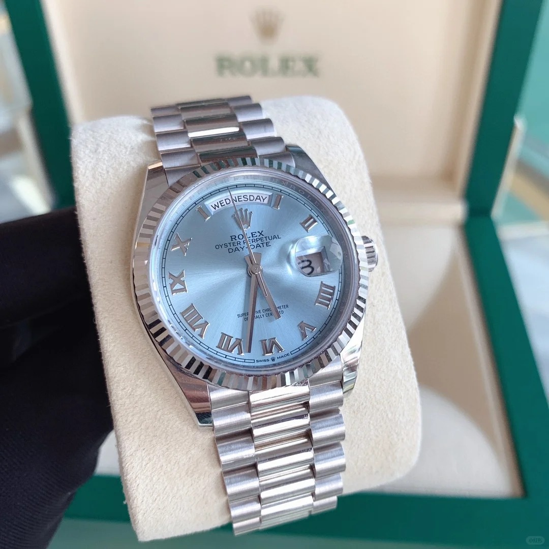 The Oyster Perpetual Day-Date 36 in platinum with an ice-blue dial, fluted bezel and President bracelet. -m128236-0018