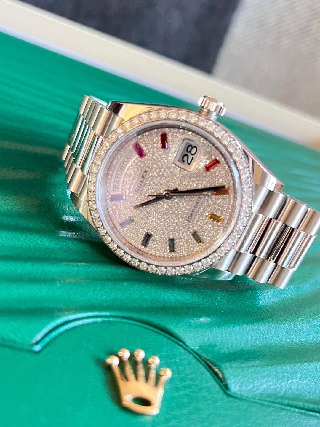 The Oyster Perpetual Day-Date, automatic, 36mm diameter, rainbow indexes, starry dial, 18k white gold case, bezel set with 52 round diamonds. -128349rbr-0006