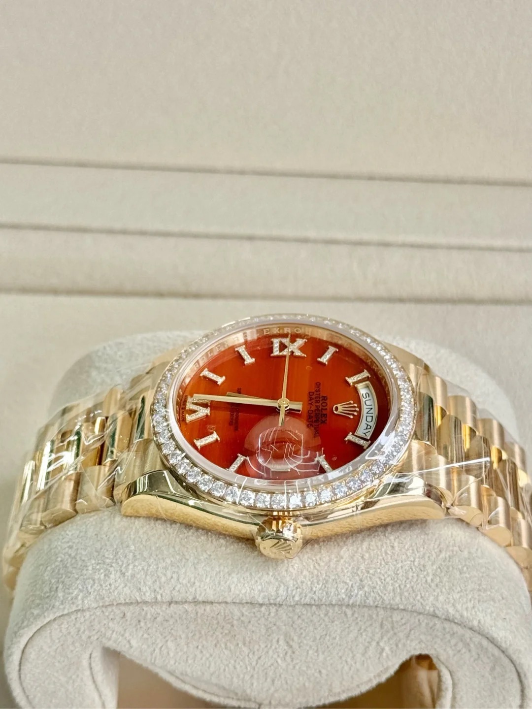 The Oyster Perpetual Day-Date 36 in 18 ct yellow gold with a diamond-set carnelian dial, diamond-set bezel and President bracelet. -m128398tbr-0018