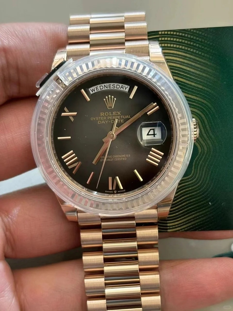 The Oyster Perpetual Day-Date 40 in 18 ct Everose gold with a grey gradient slate dial, fluted bezel and President bracelet. -m228235-0055