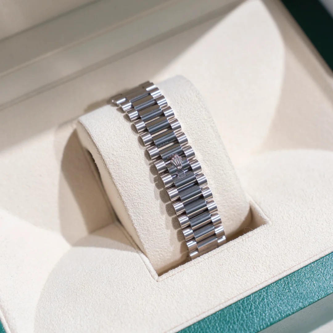 The Oyster Perpetual Day-Date, automatic, 36mm diameter, rainbow indexes, starry dial, 18k white gold case, bezel set with 52 round diamonds. -128349rbr-0006