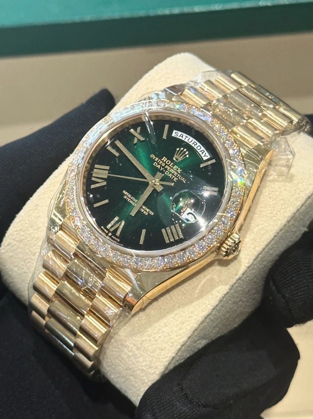 The Oyster Perpetual Day-Date 40 in 18 ct yellow gold with a gradient green dial, diamond-set bezel and President bracelet. -m228348rbr-0045