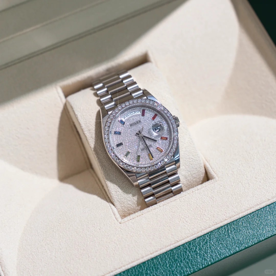 The Oyster Perpetual Day-Date, automatic, 36mm diameter, rainbow indexes, starry dial, 18k white gold case, bezel set with 52 round diamonds. -128349rbr-0006