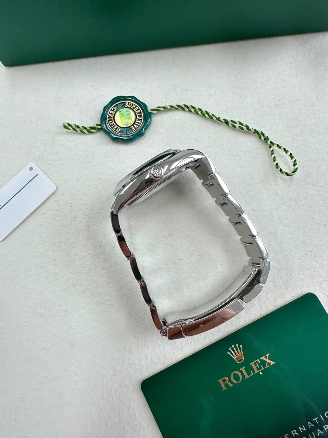 The Oyster Perpetual 36 is presented with a green dial and an Oyster bracelet. -m126000-0005