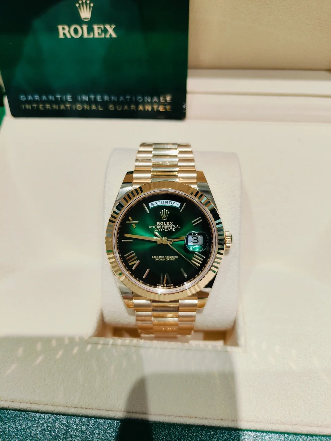The Oyster Perpetual Day-Date 40 in 18 ct yellow gold with a graduated green dial, fluted bezel and President bracelet. -m228238-0069