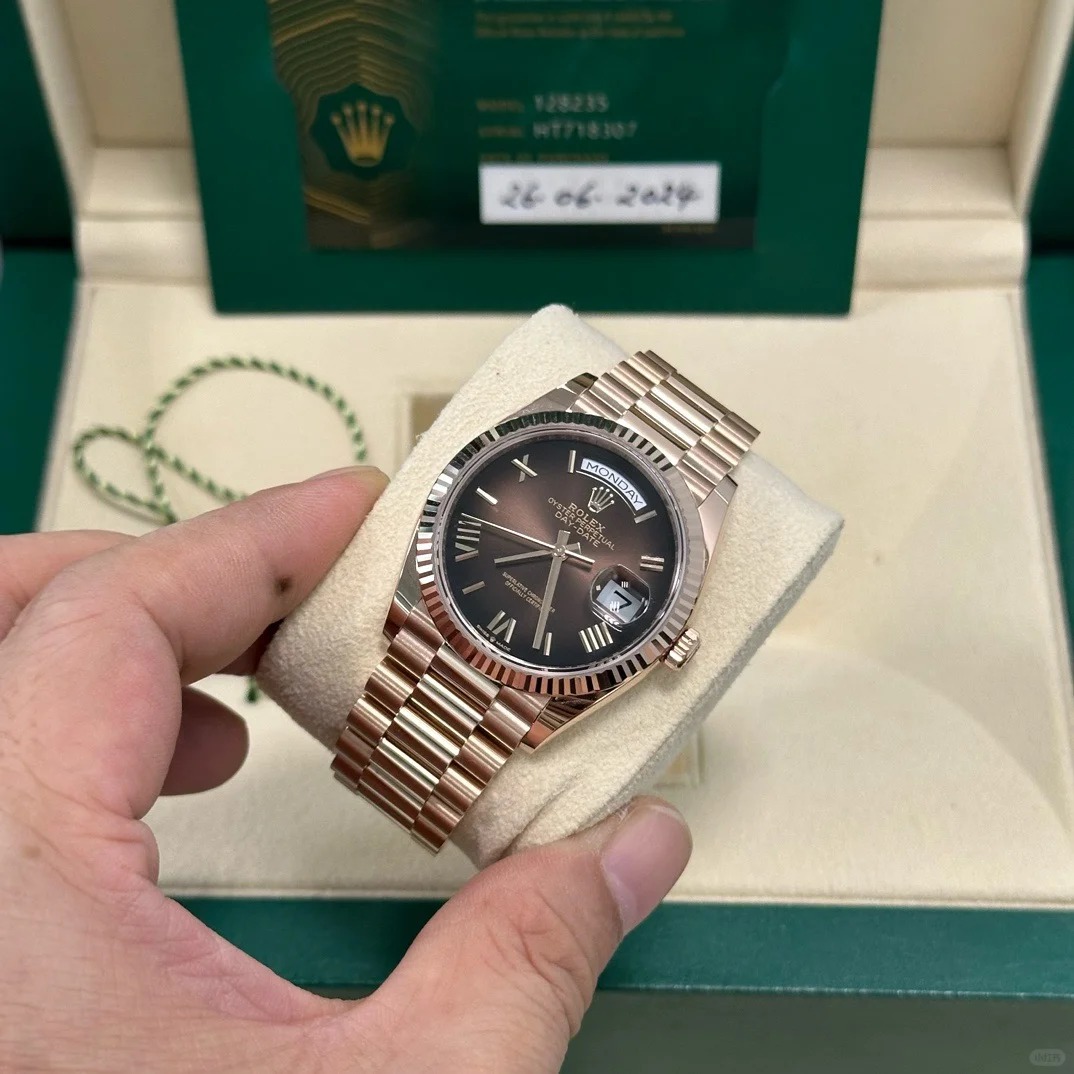 The Oyster Perpetual Day-Date 36 in 18 ct Everose gold with a graduated brown dial, fluted bezel and President bracelet. -m128235-0075