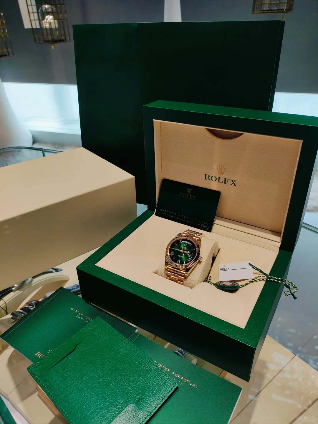 The Oyster Perpetual Day-Date 40 in 18 ct yellow gold with a graduated green dial, fluted bezel and President bracelet. -m228238-0069