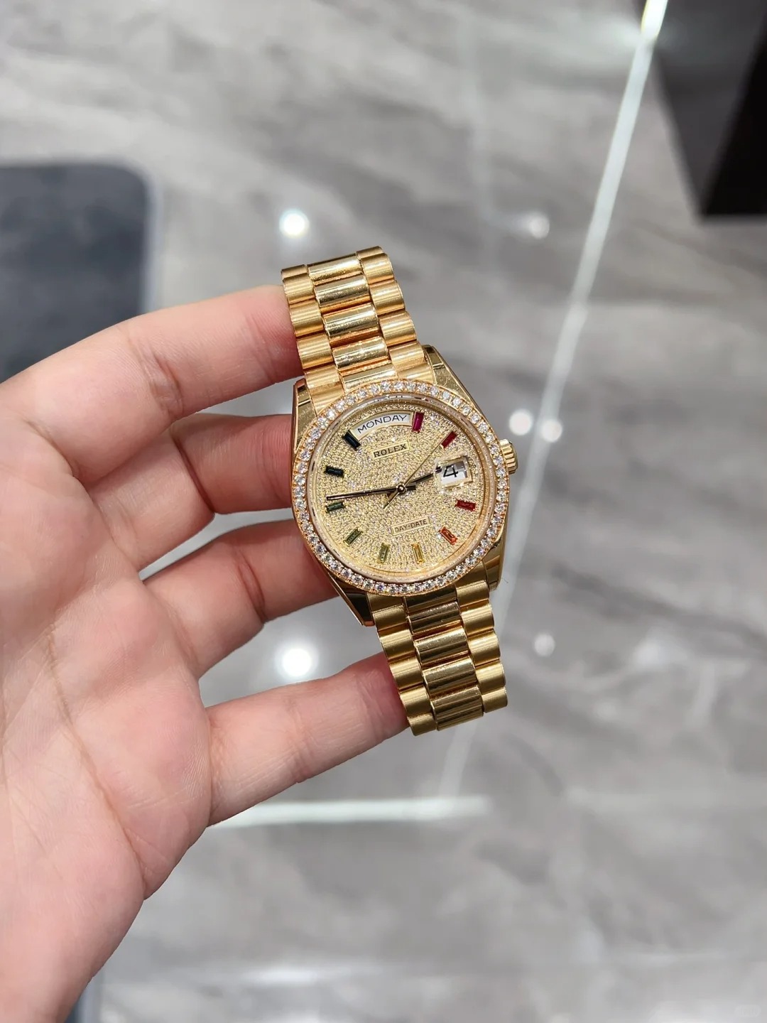 The Oyster Perpetual Day-Date 36 in 18 ct yellow gold with a diamond-paved dial, diamond-set bezel and President bracelet. -m128398tbr-0012