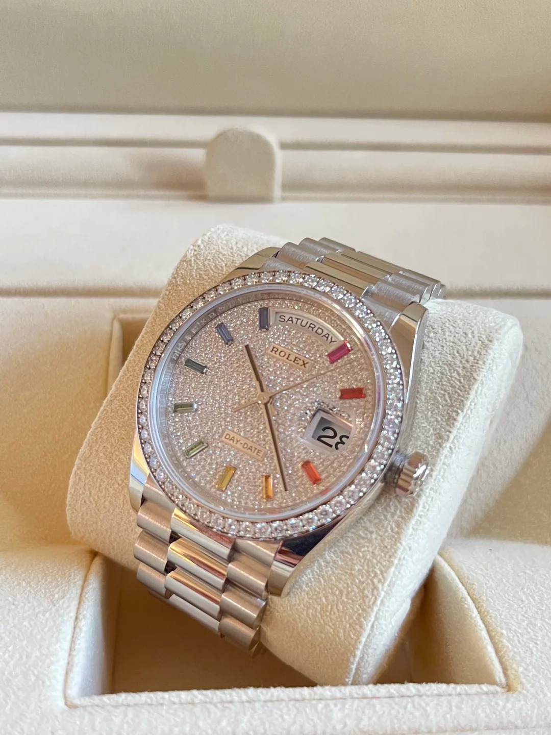 The Oyster Perpetual Day-Date, automatic, 36mm diameter, rainbow indexes, starry dial, 18k white gold case, bezel set with 52 round diamonds. -128349rbr-0006