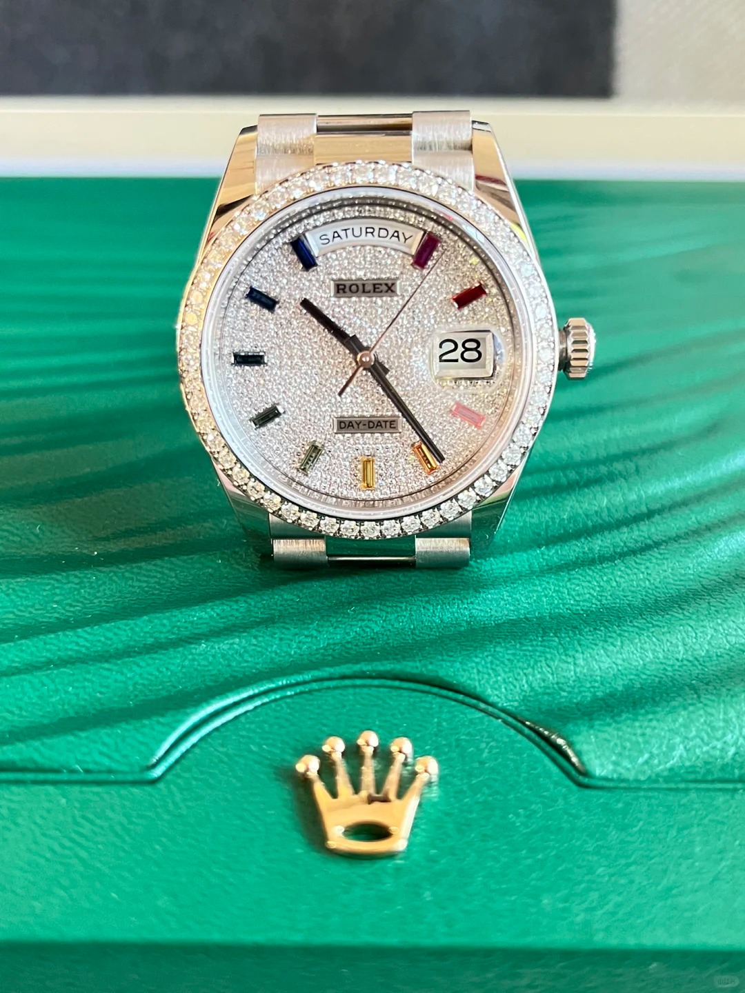 The Oyster Perpetual Day-Date, automatic, 36mm diameter, rainbow indexes, starry dial, 18k white gold case, bezel set with 52 round diamonds. -128349rbr-0006