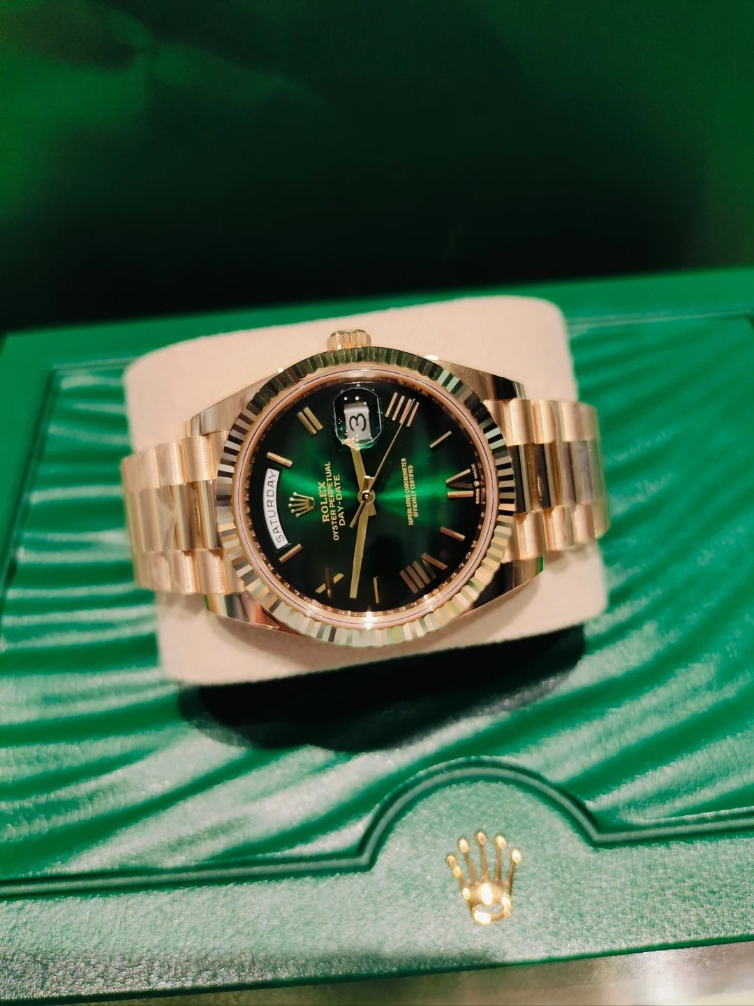 The Oyster Perpetual Day-Date 40 in 18 ct yellow gold with a graduated green dial, fluted bezel and President bracelet. -m228238-0069