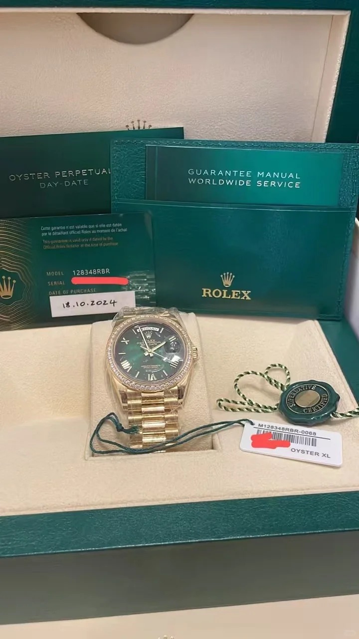 The Oyster Perpetual Day-Date 36 in 18 ct yellow gold with a graduated green dial, diamond-set bezel and President bracelet. -m128348rbr-0068