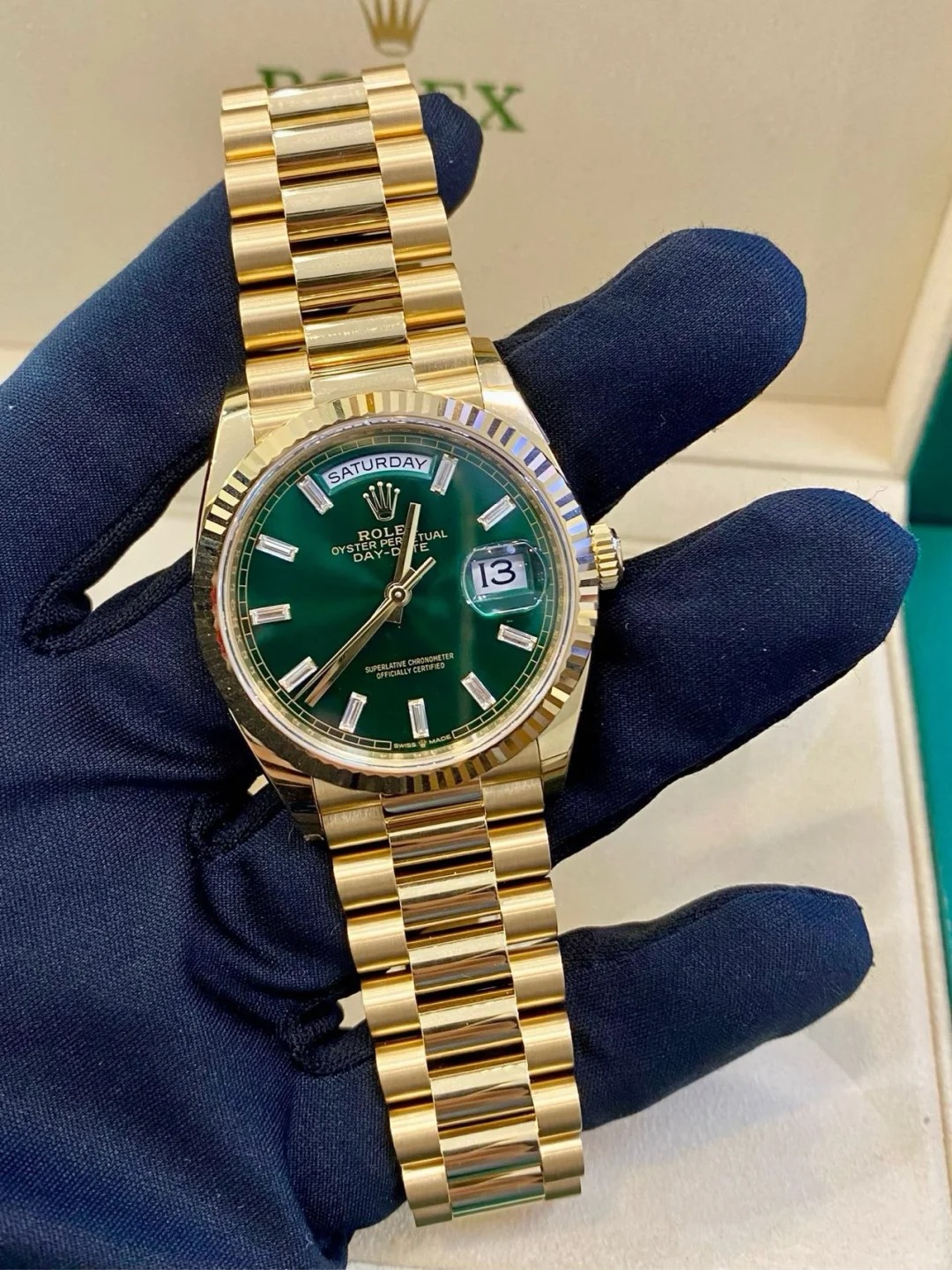 The Oyster Perpetual Day-Date 36 in 18 ct yellow gold with a brilliant green diamond-set dial, fluted bezel and President bracelet. -m128238-0130