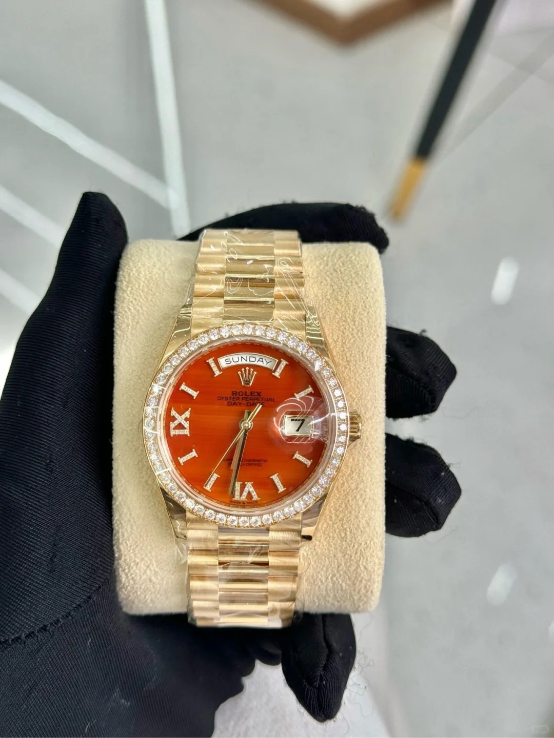 The Oyster Perpetual Day-Date 36 in 18 ct yellow gold with a diamond-set carnelian dial, diamond-set bezel and President bracelet. -m128398tbr-0018