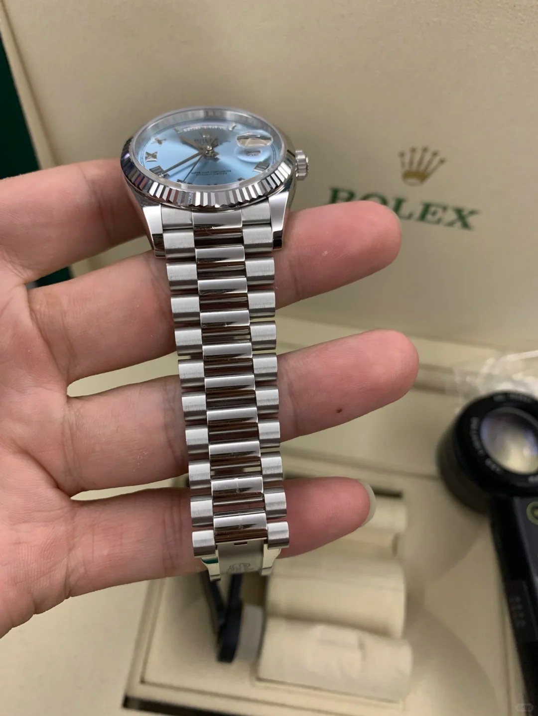The Oyster Perpetual Day-Date 36 in platinum with an ice-blue dial, fluted bezel and President bracelet. -m128236-0018
