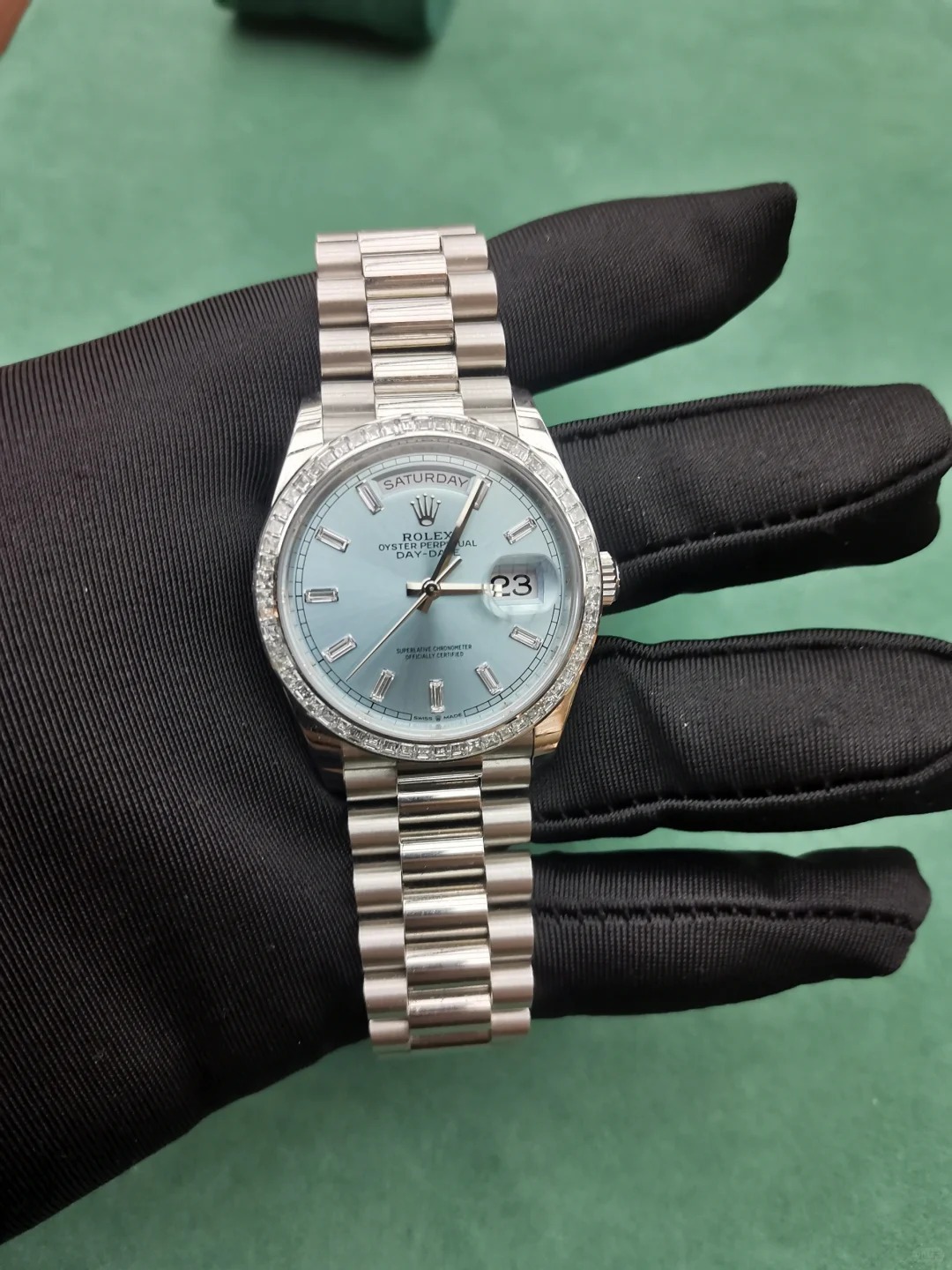 The Oyster Perpetual Day-Date 36 in platinum with an ice-blue dial, diamond-set bezel and President bracelet. -m128396tbr-0019