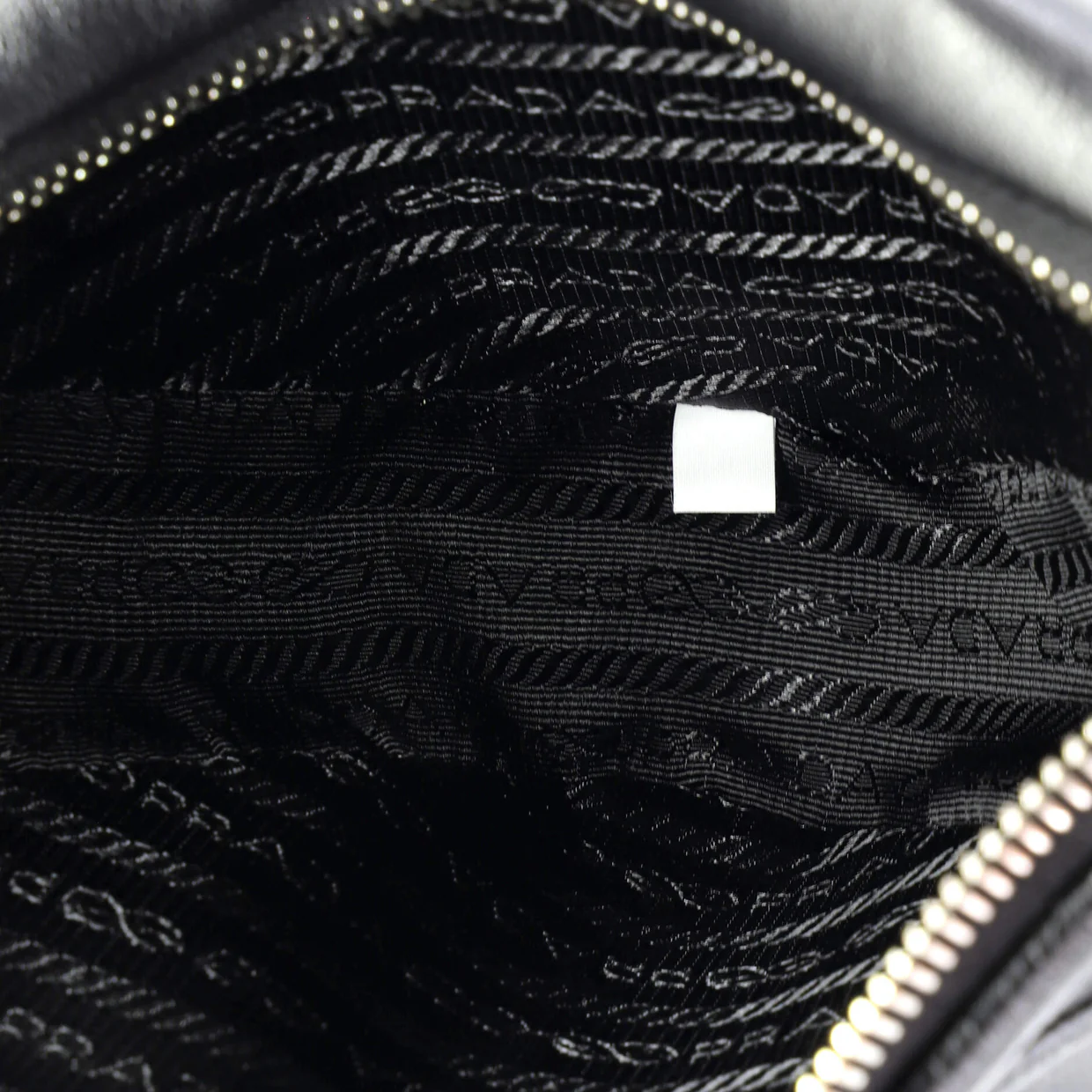 Triangle Logo Wristlet Pouch Embossed Leather - Deep Luxury
