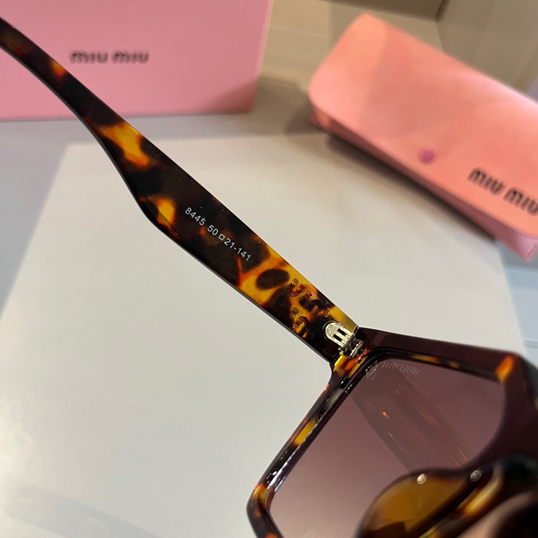 MIUMIU-New black gold Sunglasses