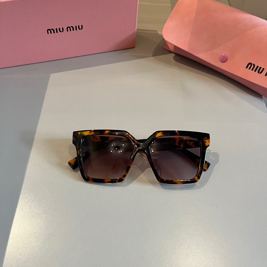 MIUMIU-New black gold Sunglasses