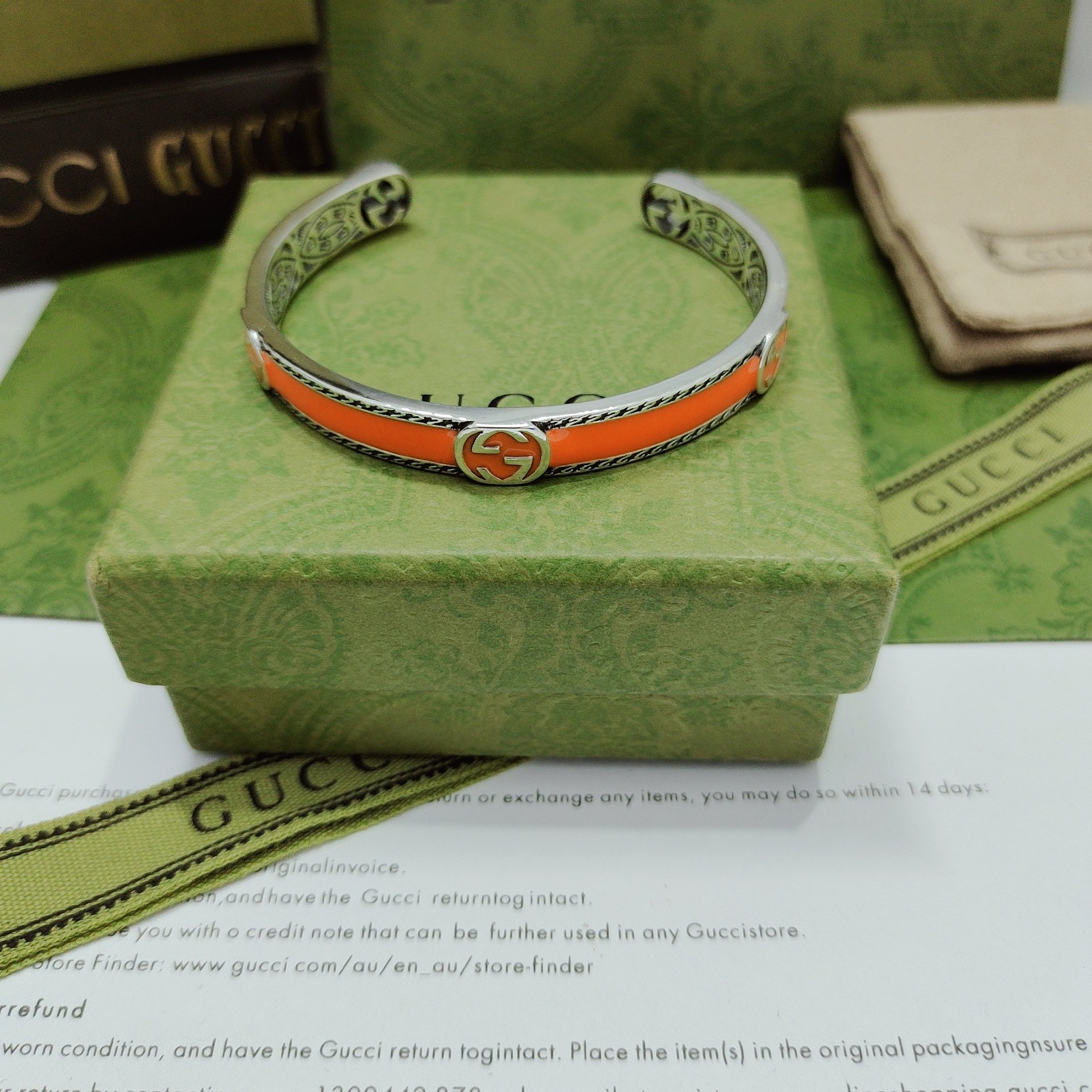 GUCCI-Orange enamel and woven rolled edge bracelet